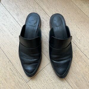 Black leather tibi mules